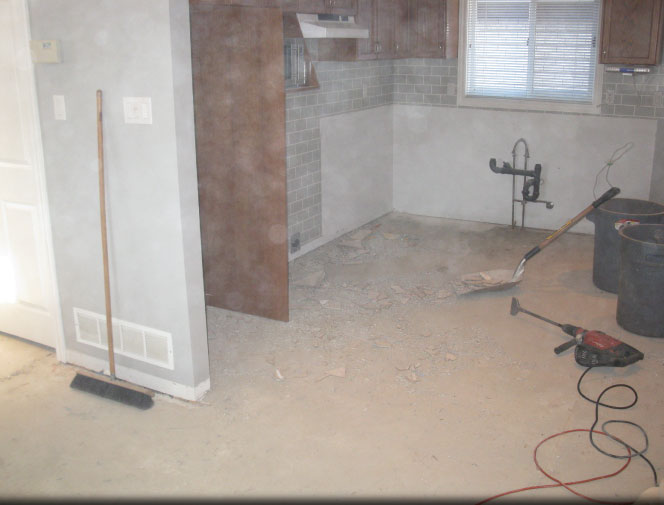 Removed kitchen & tore out ceramic floor from kitchen & hallway.