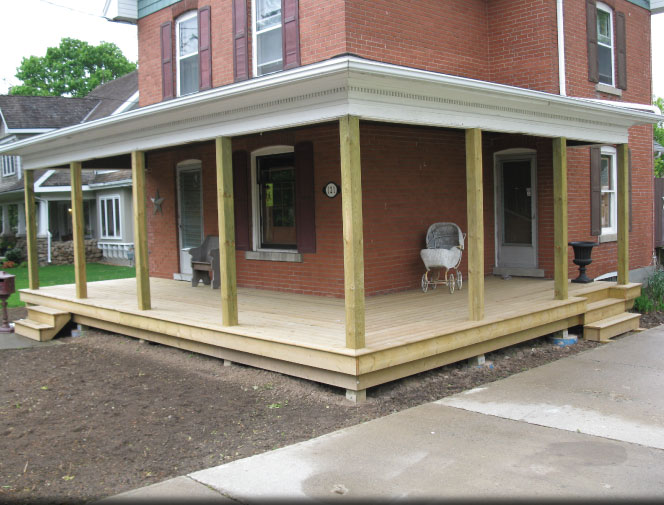 Porch roof is supported. New concrete piers, posts & decking is installed.