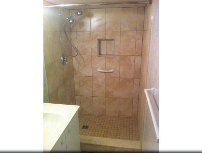 New ceramic shower stall with built in soap niche.